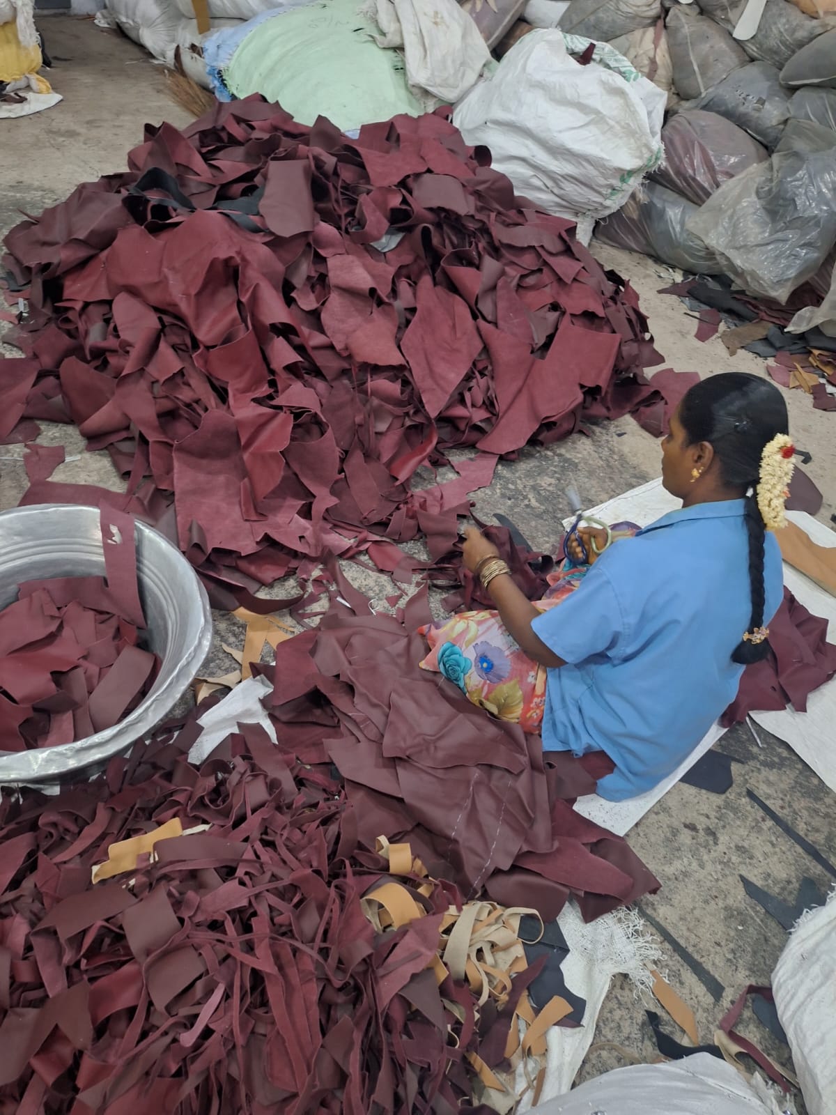 Close-up of worker grading leather pieces